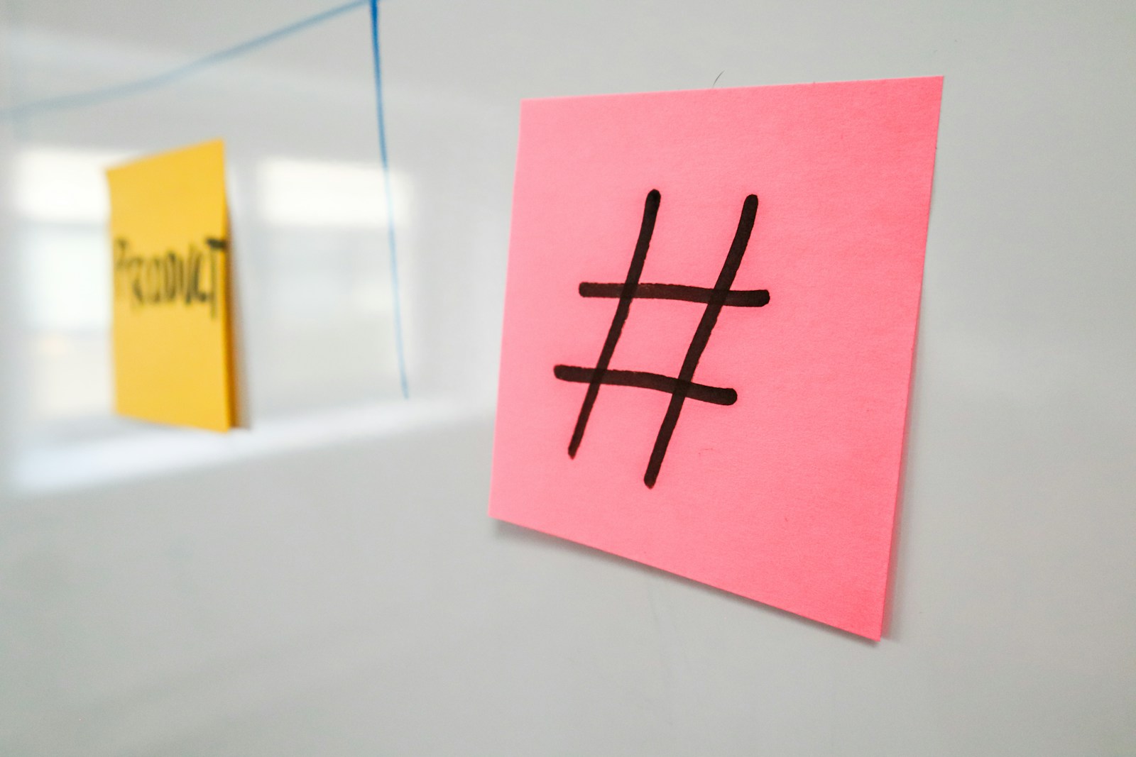 a pink piece of paper with a hash symbol on it